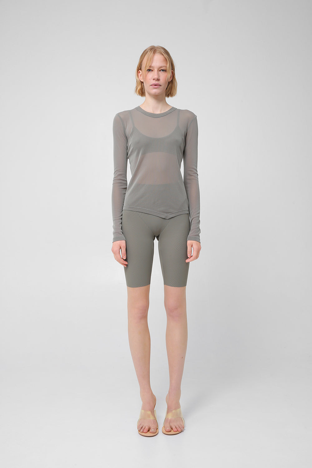 Transparent long-sleeve top with asymmetric hem