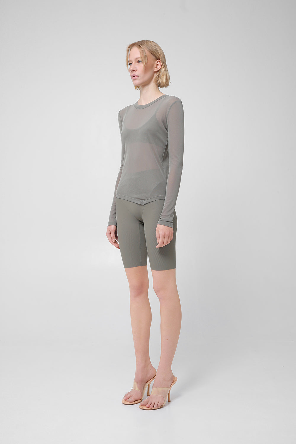Transparent long-sleeve top with asymmetric hem